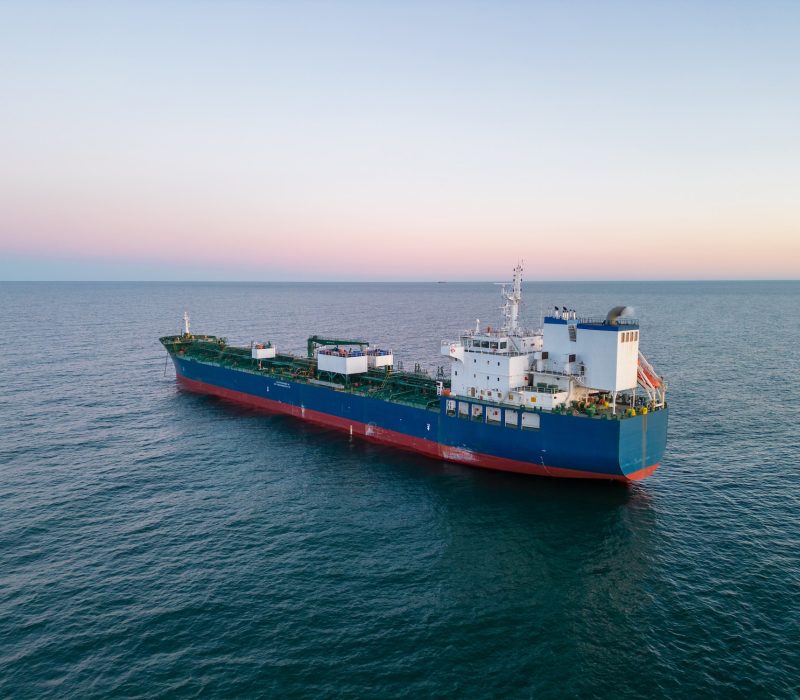 Aerial view oil ship tanker carrier oil on the sea at sunset