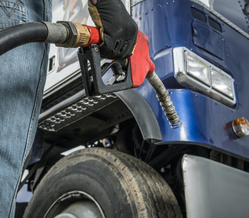 Trucker in Front of His Truck Preparing For Diesel Fueling